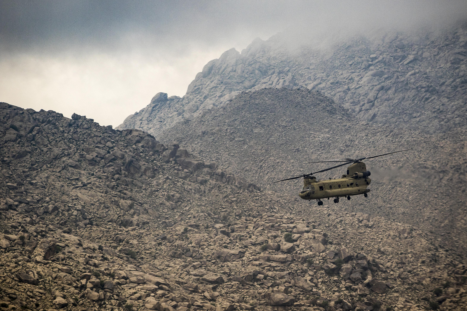 US Army Boeing CH-47 Chinook tandem-rotor helicopter flying near Jalalabad, Afghanistan