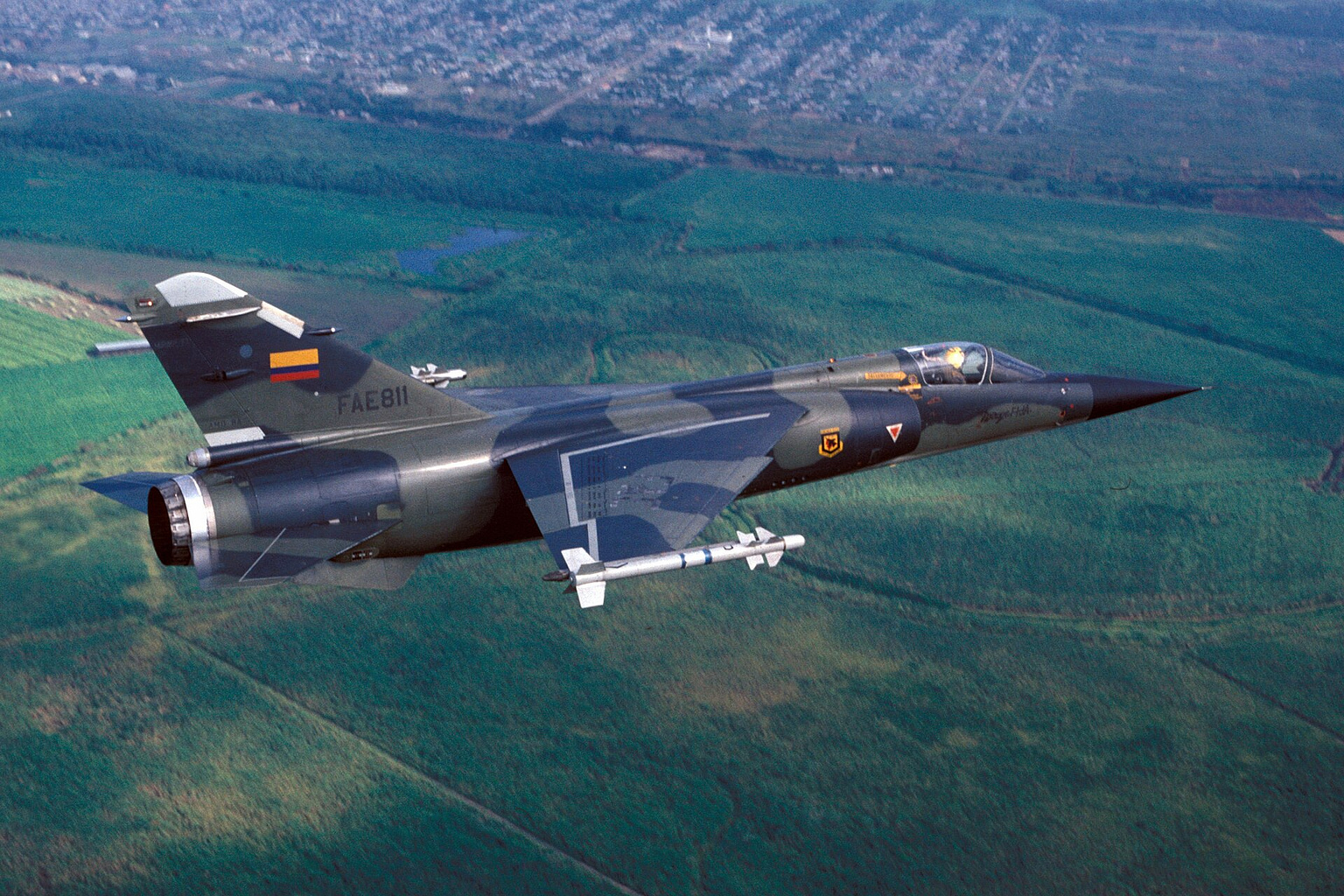 Dassault Mirage F1 fighter in flight over terrain