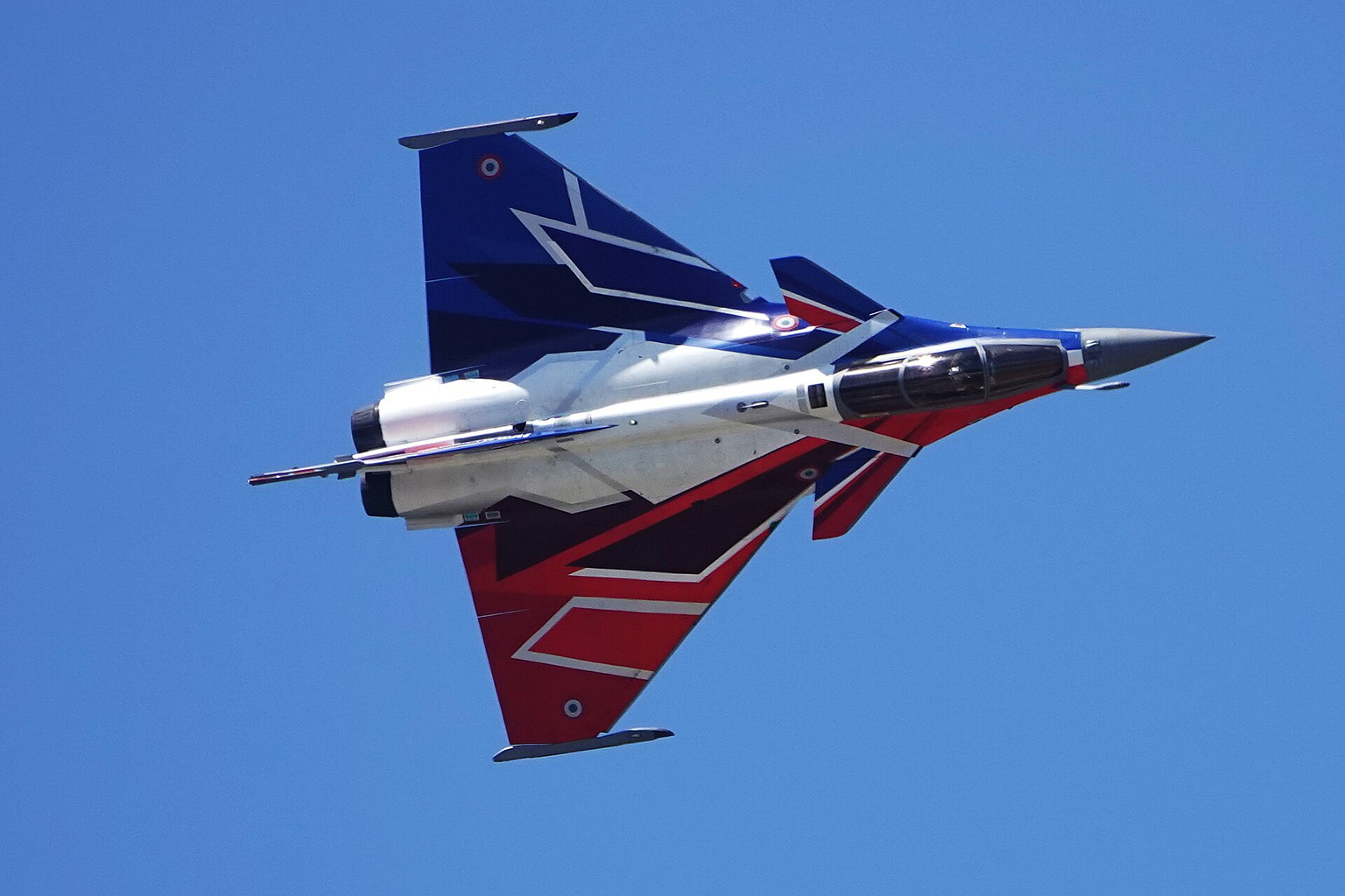 Dassault Rafale solo display fighter banking in flight