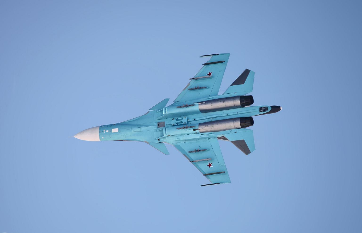 Sukhoi Su-34 Fullback strike fighter in flight with weapons under its wings