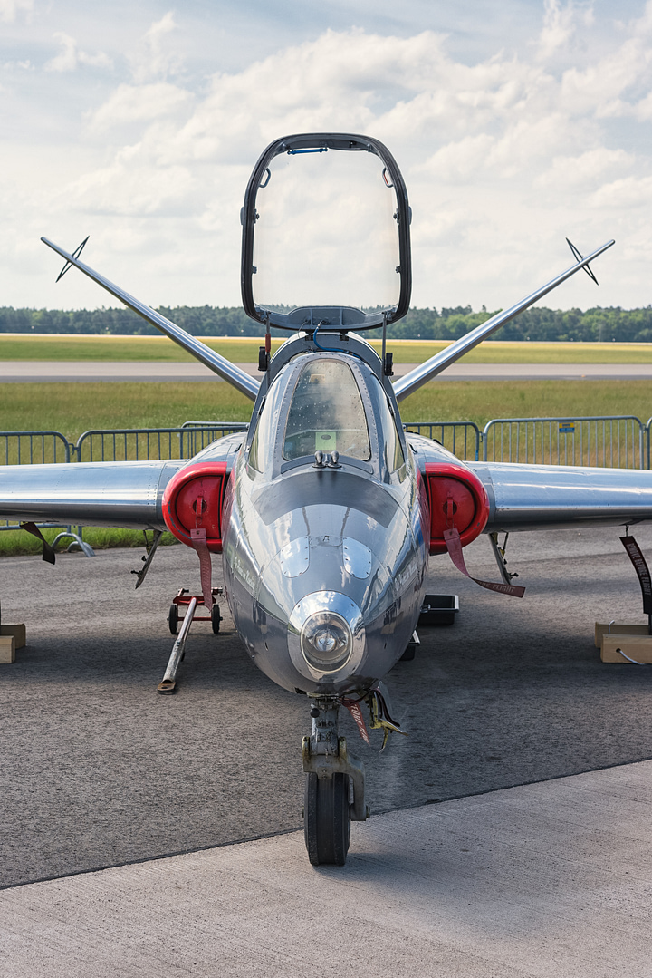 Close up on the ground: the twin-boom V-tail and slim glider-derived wing.