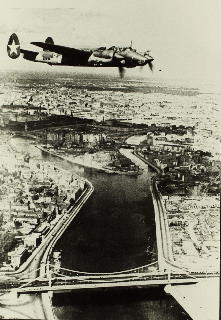 A Soviet Tu-2 in red-star markings over a European city, June 1945.