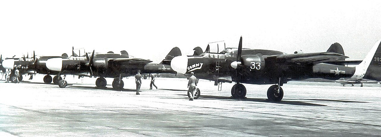 Line of P-61 Black Widow night fighters on a ramp