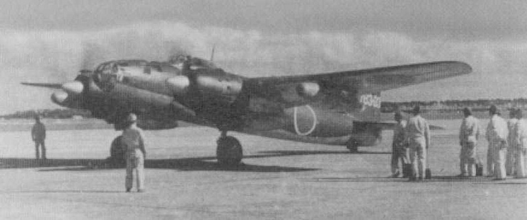 A Ginga with ground crew the scale of the clean twin-engine airframe is clear.