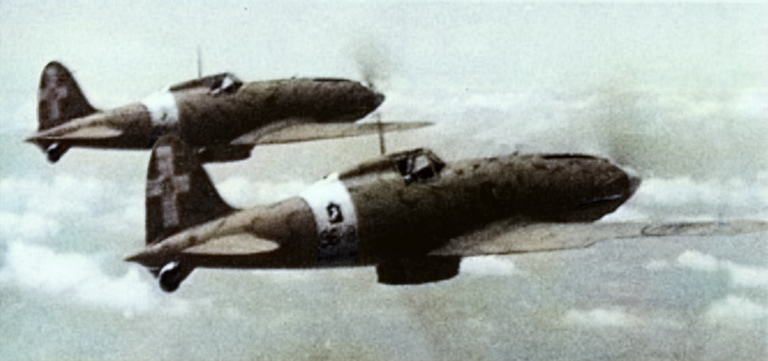 Macchi C.202 Folgore fighters lined up at a desert airfield