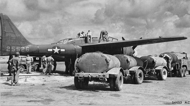 P-61 Black Widow with ground crew loading ordnance