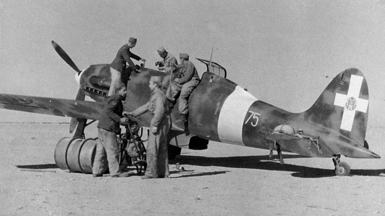Ground crew refuel a Macchi C.202 Folgore in North Africa