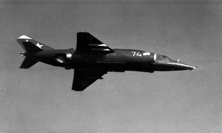An air-to-air underside view of a Forger-A, showing its lift-jet bays and stores.