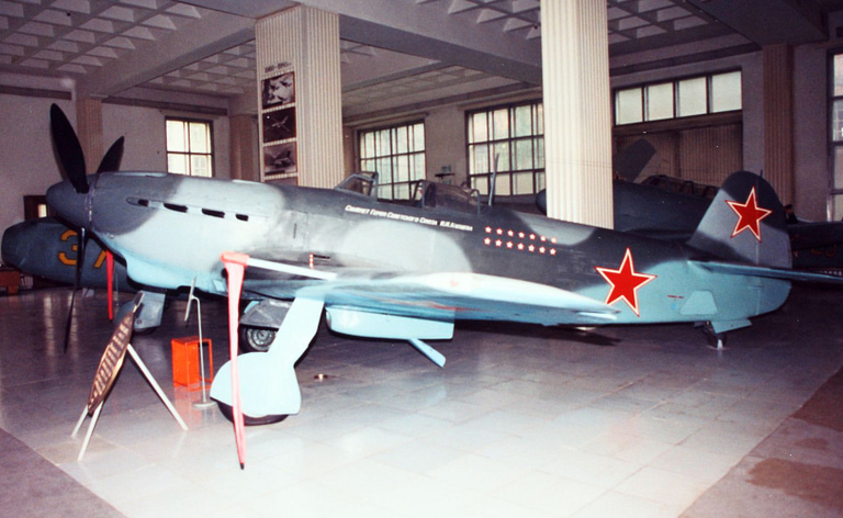 Side profile of a museum Yakovlev Yak-9 with Soviet red star