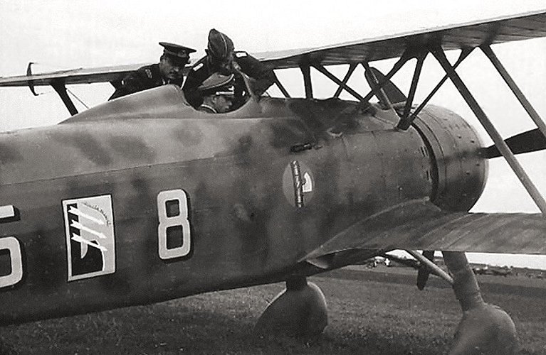 A German officer in the cockpit of a captured Fiat CR.42 in Belgium