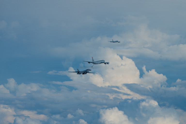 A B-1B refuels behind a KC-135 tanker how the Bone reaches intercontinental range.