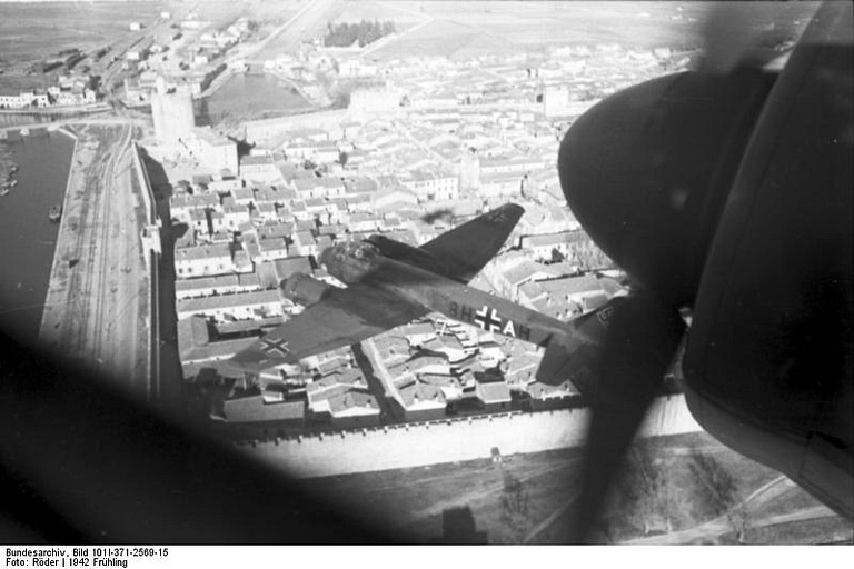 A Ju 88 over a European city the type flew as a fast level and dive bomber across the Western Front.