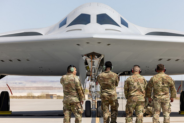 Ground crew beside the second production-representative B-21 Raider