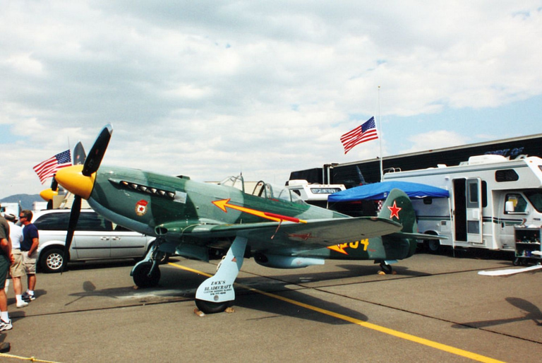 Restored Yakovlev Yak-9 parked on an airshow flightline