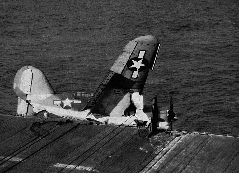 A Curtiss SB2C Helldiver crash-lands aboard a US carrier
