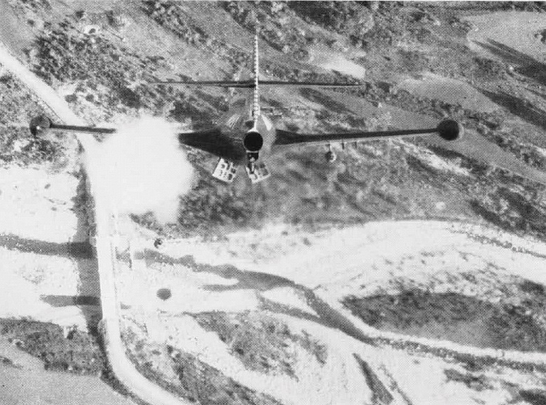A VF-71 F9F-2 Panther fires rockets at a bridge in Korea, November 1952.