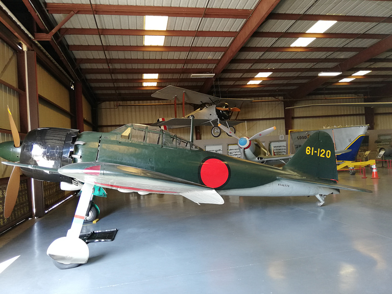 A preserved A6M Zero on museum display, wearing Imperial Japanese Navy markings.