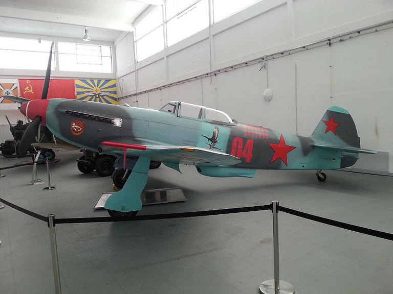 Bare-metal Yakovlev Yak-9 D-FAFA in a museum hangar