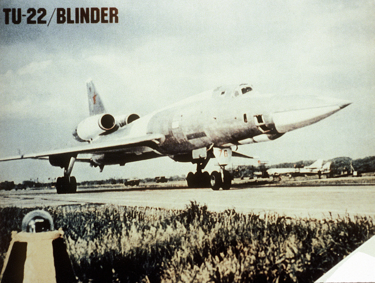 A right-front view of a parked Soviet Tu-22 Blinder the long nose and tail-mounted engines are clearly visible.