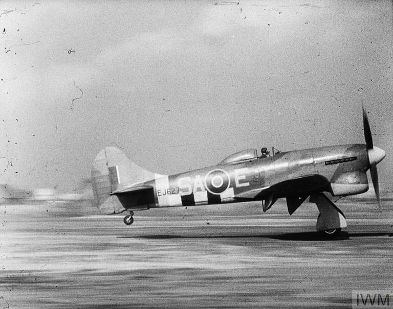 A Tempest V of 486 (NZ) Squadron lifting off from Volkel, Holland, on operations with the 2nd Tactical Air Force.