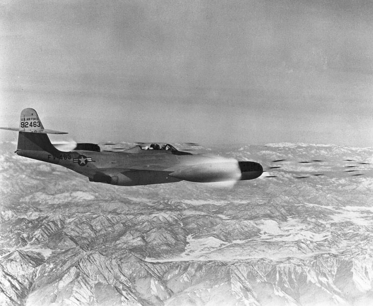 An F-89D firing a salvo of 2.75-inch Mighty Mouse rockets from its wingtip pods.