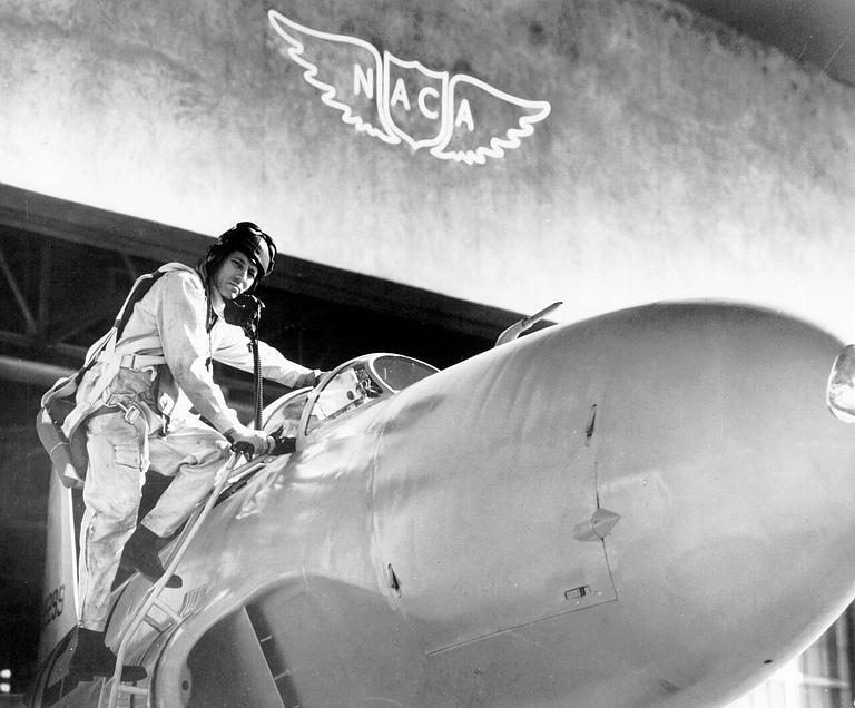Test pilot Lawrence Clousing beside a Lockheed P-80