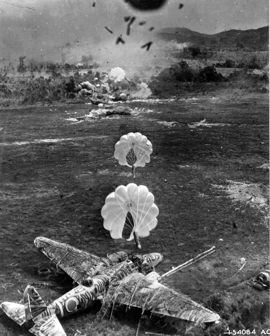 A camouflaged Ki-21-IIb caught on its airfield in an Allied strafing run.