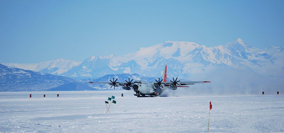 A ski-equipped LC-130 Hercules operating from a snow runway the polar-resupply version of the Herc.