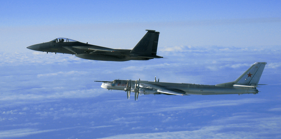 A US Air Force F-15C escorts a Russian Tu-95MS off Alaska in 2006 the Cold War intercept ritual, still recurring.