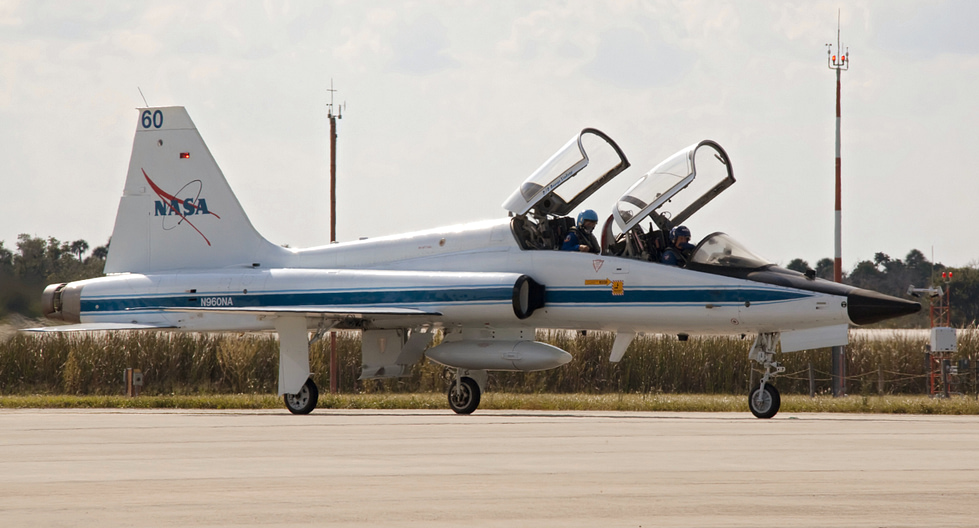 A white NASA T-38 carrying a Space Shuttle crew the astronauts own jet.