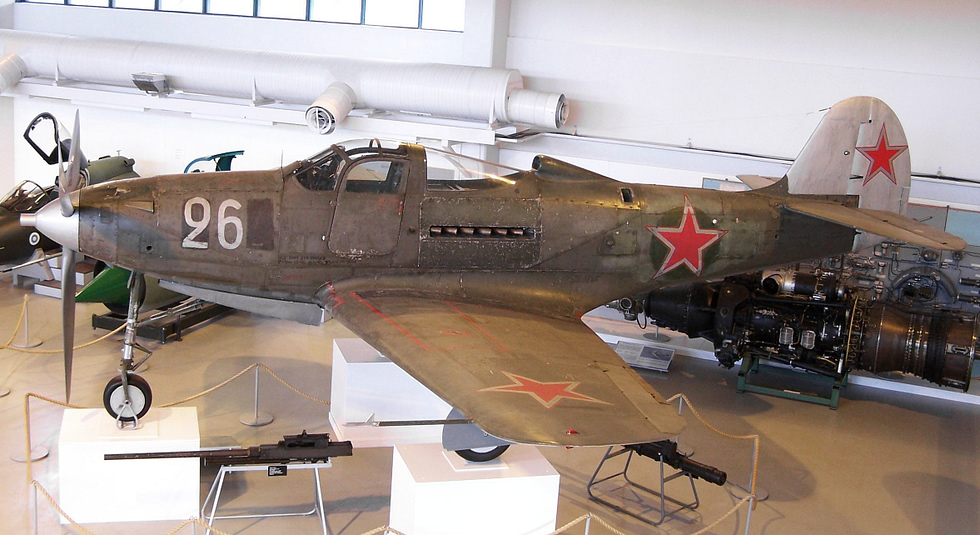 A Bell P-39 Airacobra in flight the mid-engine fighter with a cannon in its nose.