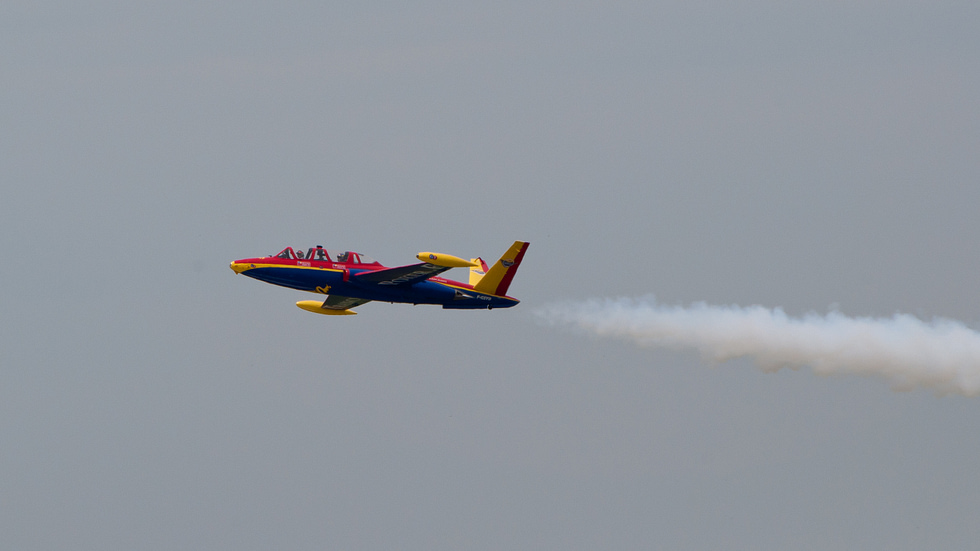 A Fouga Magister in flight the butterfly V-tail unmistakable against the sky.