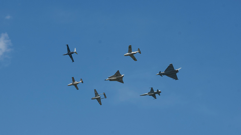 The Tunnan in flight the swept wing and barrel fuselage clear against the sky.
