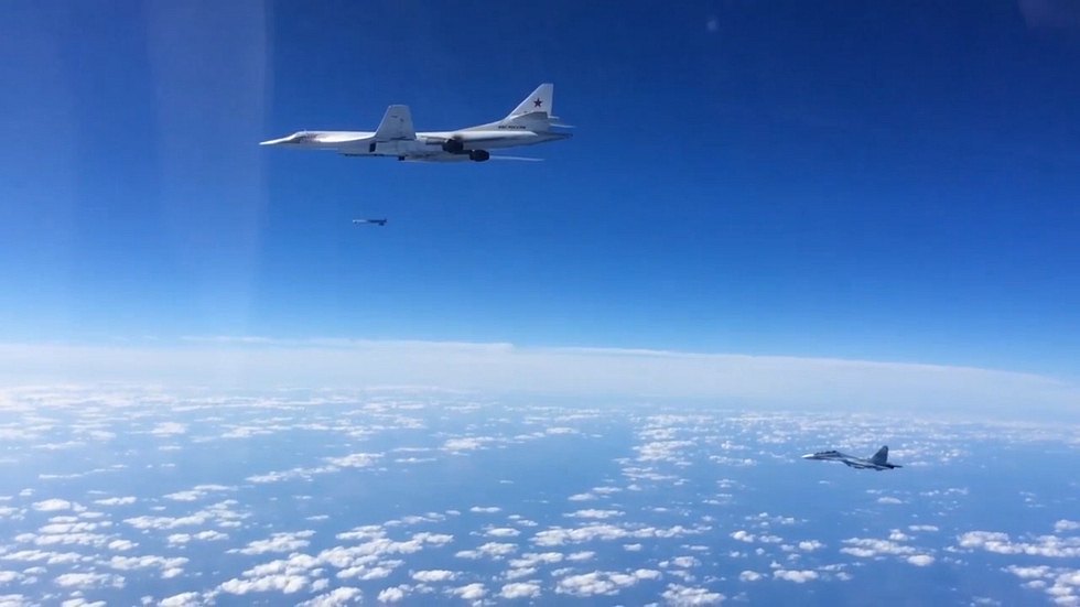 A Tu-160 launching a cruise missile, escorted by a Su-30 the stand-off strike role.