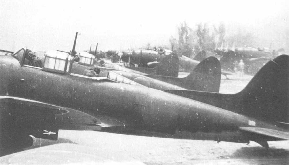 A restored D3A with open cockpit, showing the tandem crew positions of pilot and observer.