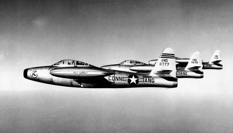 A formation of straight-wing F-84D Thunderjets the Korea-era generation.