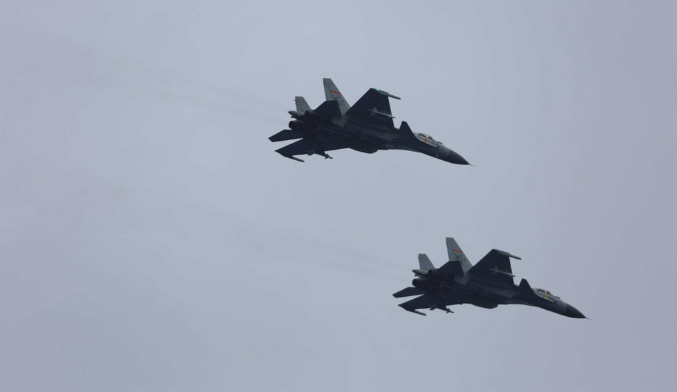 Two PLA Navy J-15s in formation the navalised Flanker that flies from Chinas carriers.