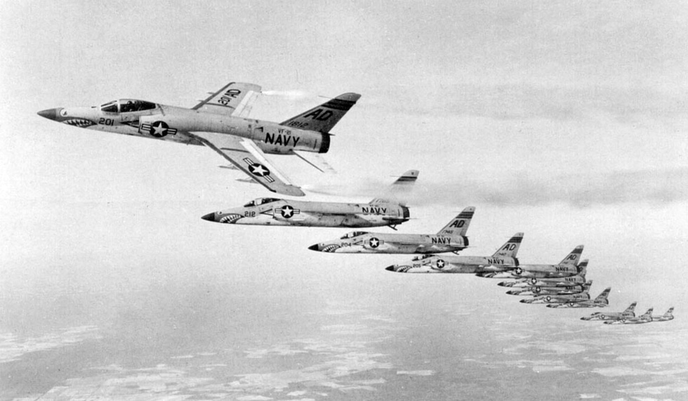Grumman F11F-1 Tigers of VF-21 in formation flight the Navys sleek area-ruled day fighter.