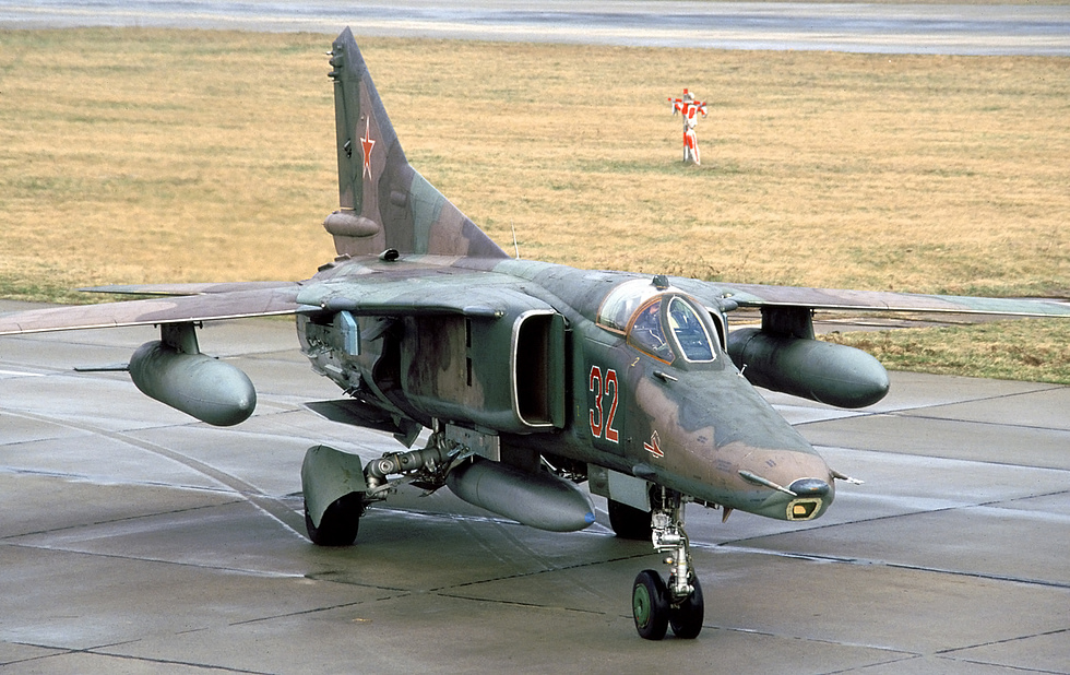 A MiG-27 on display the swing-wing strike aircraft in profile.