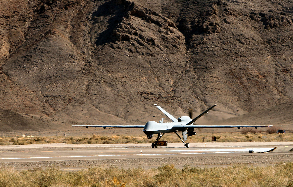 Airmen prepare an MQ-9 Reaper for launch the human end of an aircraft with no one aboard.