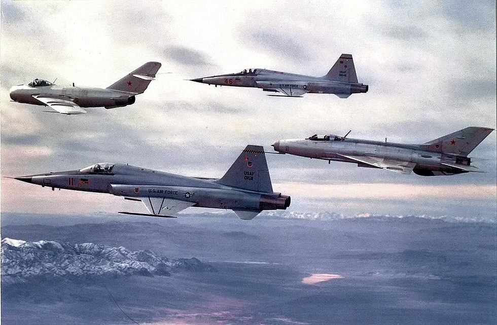 Two F-5s fly with a real MiG-17 and MiG-21 of the secret 4477th Red Eagles unit.