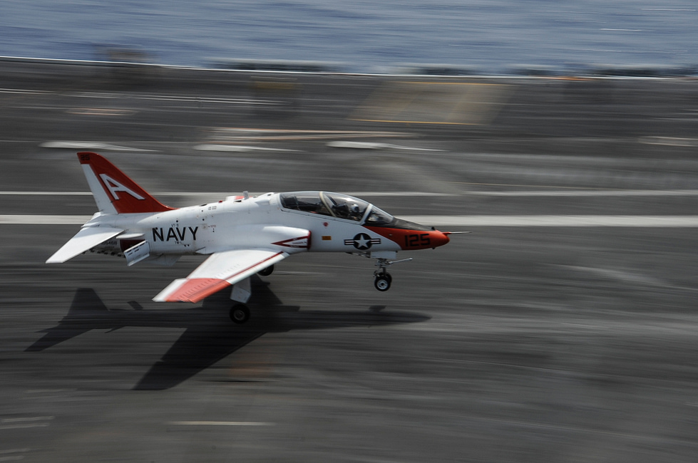 A T-45 catches the wire aboard USS Theodore Roosevelt the arrested landing every naval aviator must master.