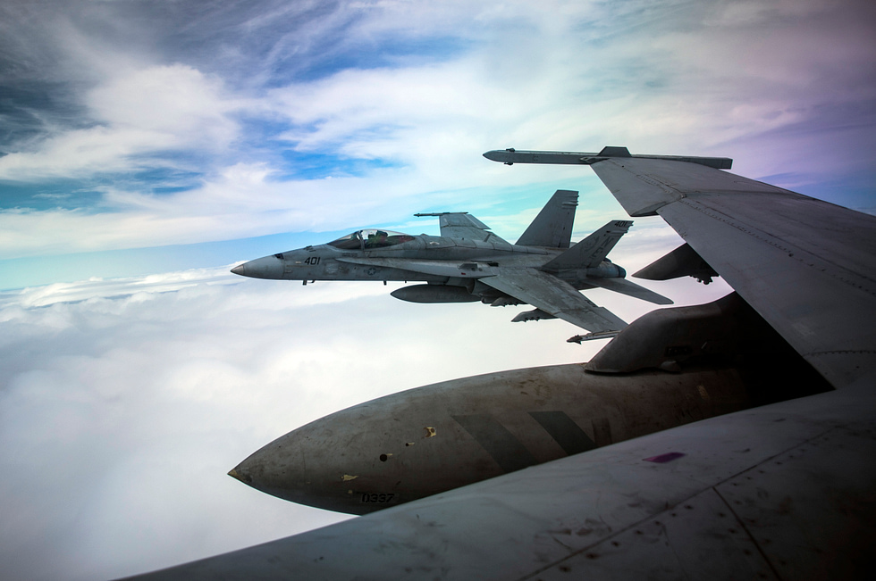 A US Navy F/A-18C Hornet in flight the clean lines of the original legacy jet.