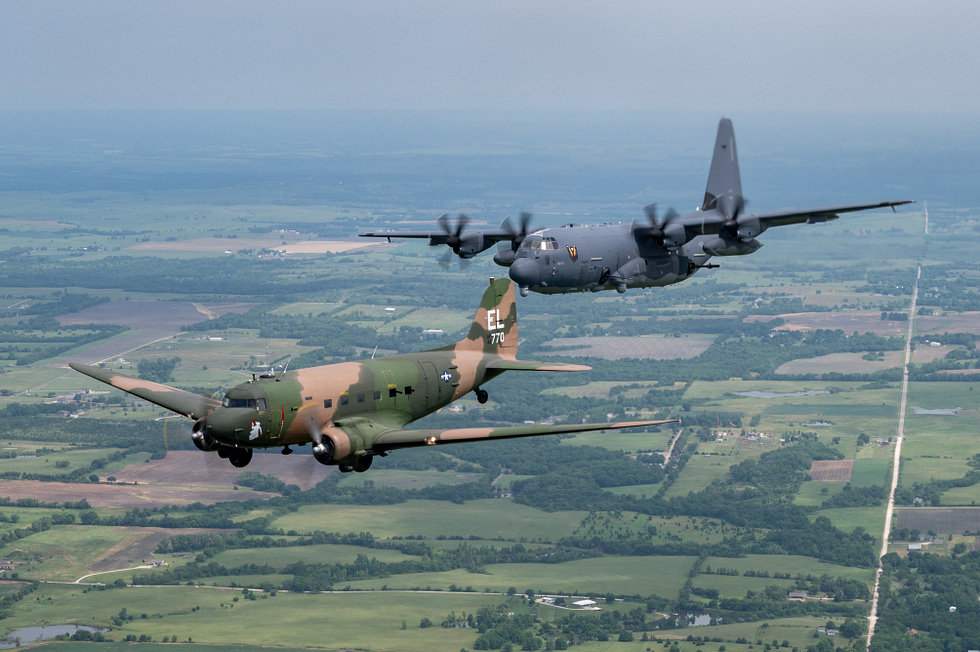 A restored AC-47 and a modern AC-130J fly a gunship legacy formation.