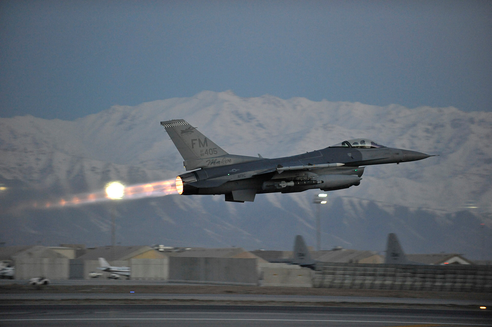 An F-15 climbing away in full afterburner thrust-to-weight above one.