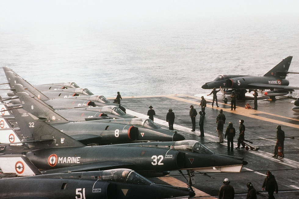 An Étendard IVM beside a Super Étendard on the deck of the carrier Foch, 1983 parent and successor together.