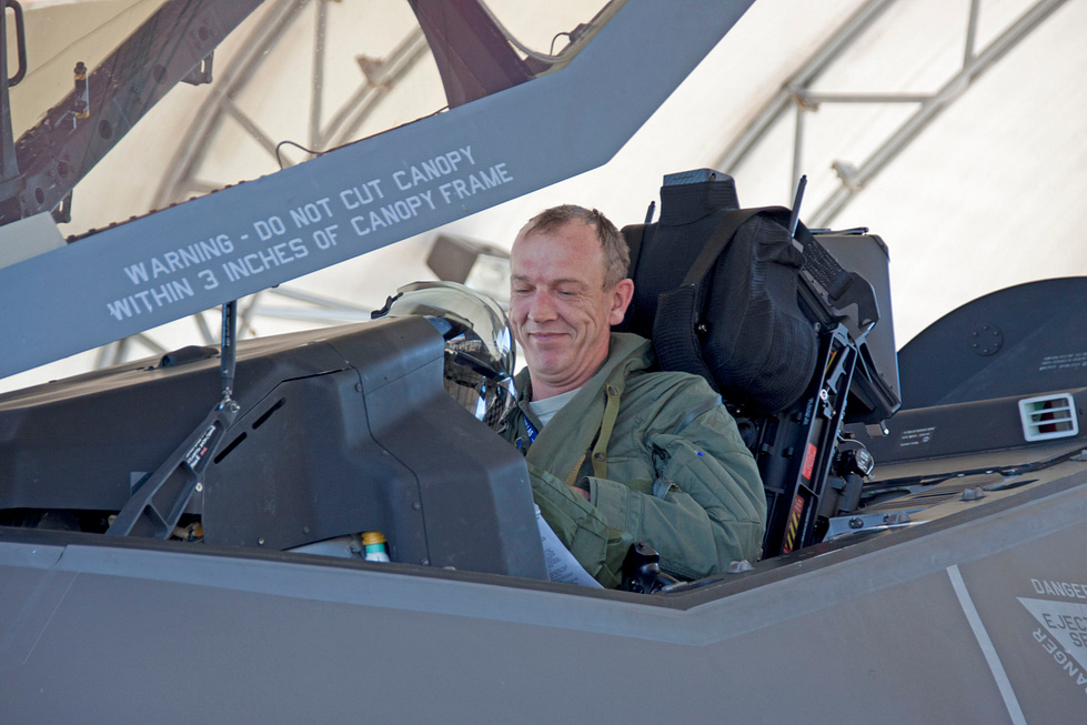An F-35 pilot wearing the Gen III helmet-mounted display that streams a fused battlespace picture.
