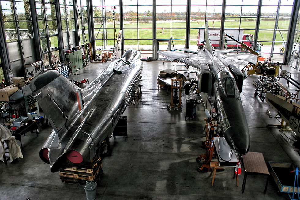 A Marut airframe in bare metal beside a MiG-23 the clean, area-ruled lines on show.