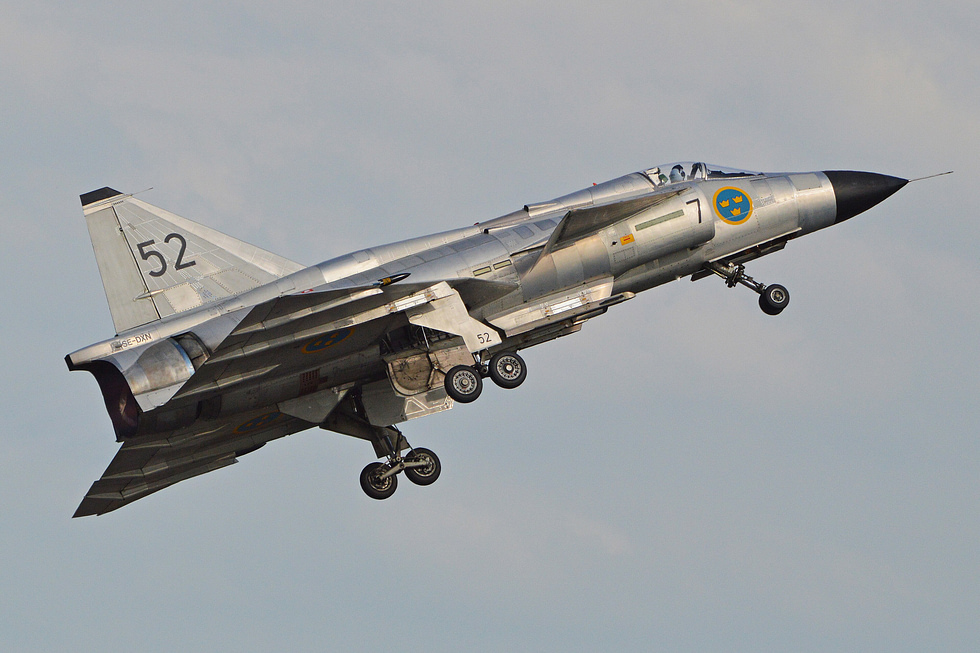 A Saab AJS 37 Viggen airborne the canard foreplane and broad delta that defined its shape.