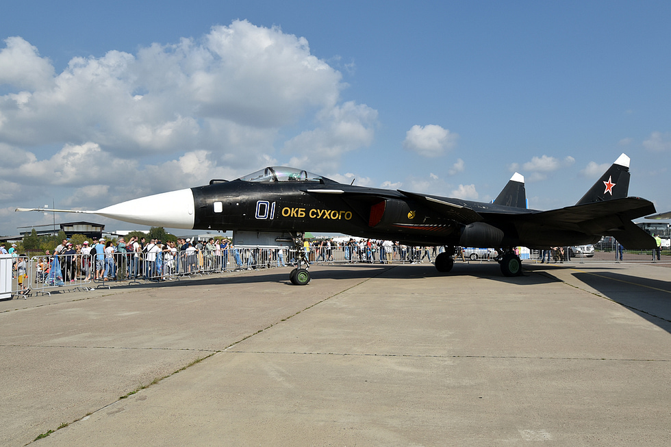 A clean side-on view of the sole Su-47 on the ground canards, forward-swept wing and twin tails in one line.